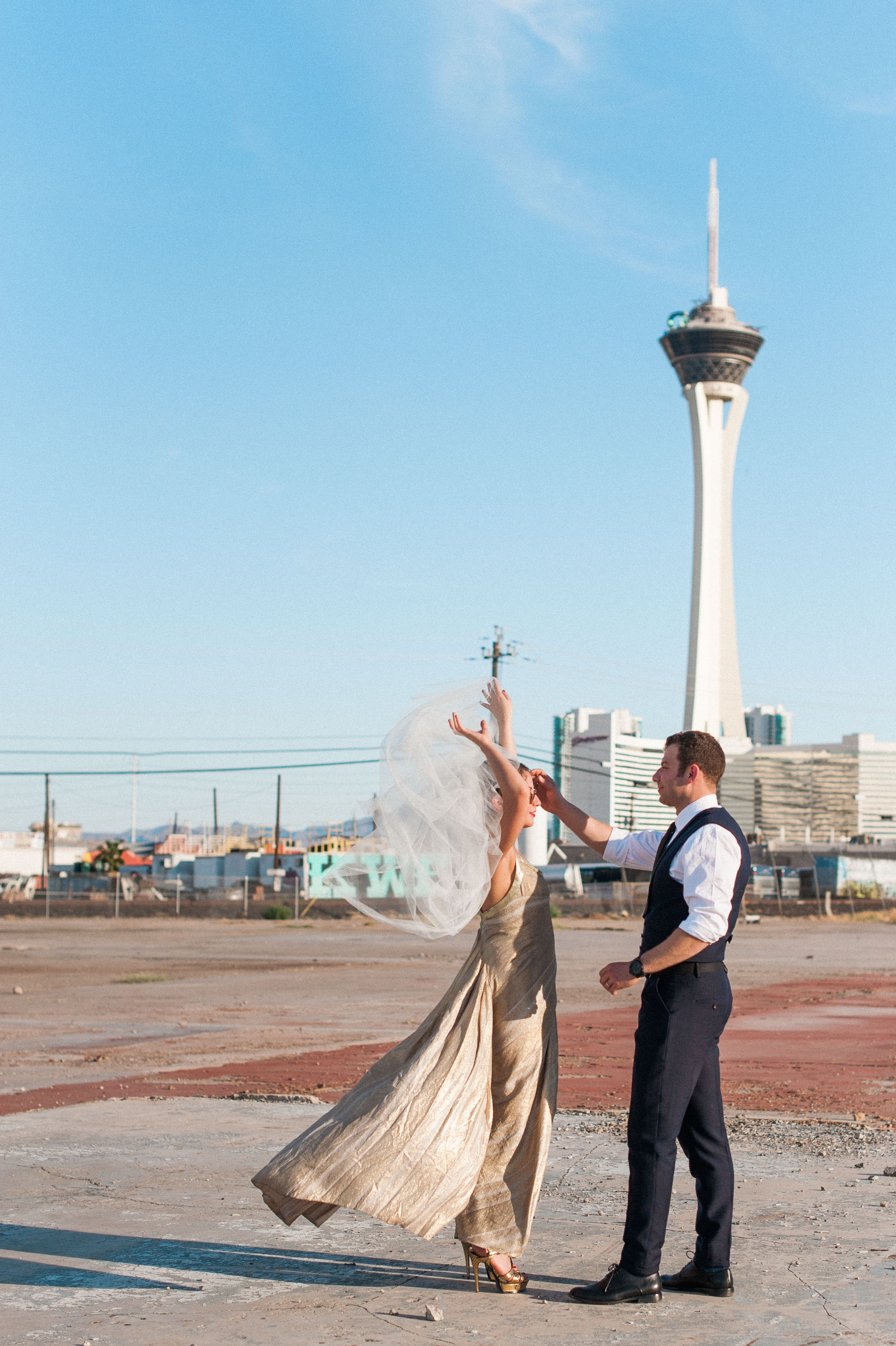A bride lifts her veil for her groom in Las Vegas, Nevada. Wedding photography by Briana Morrison