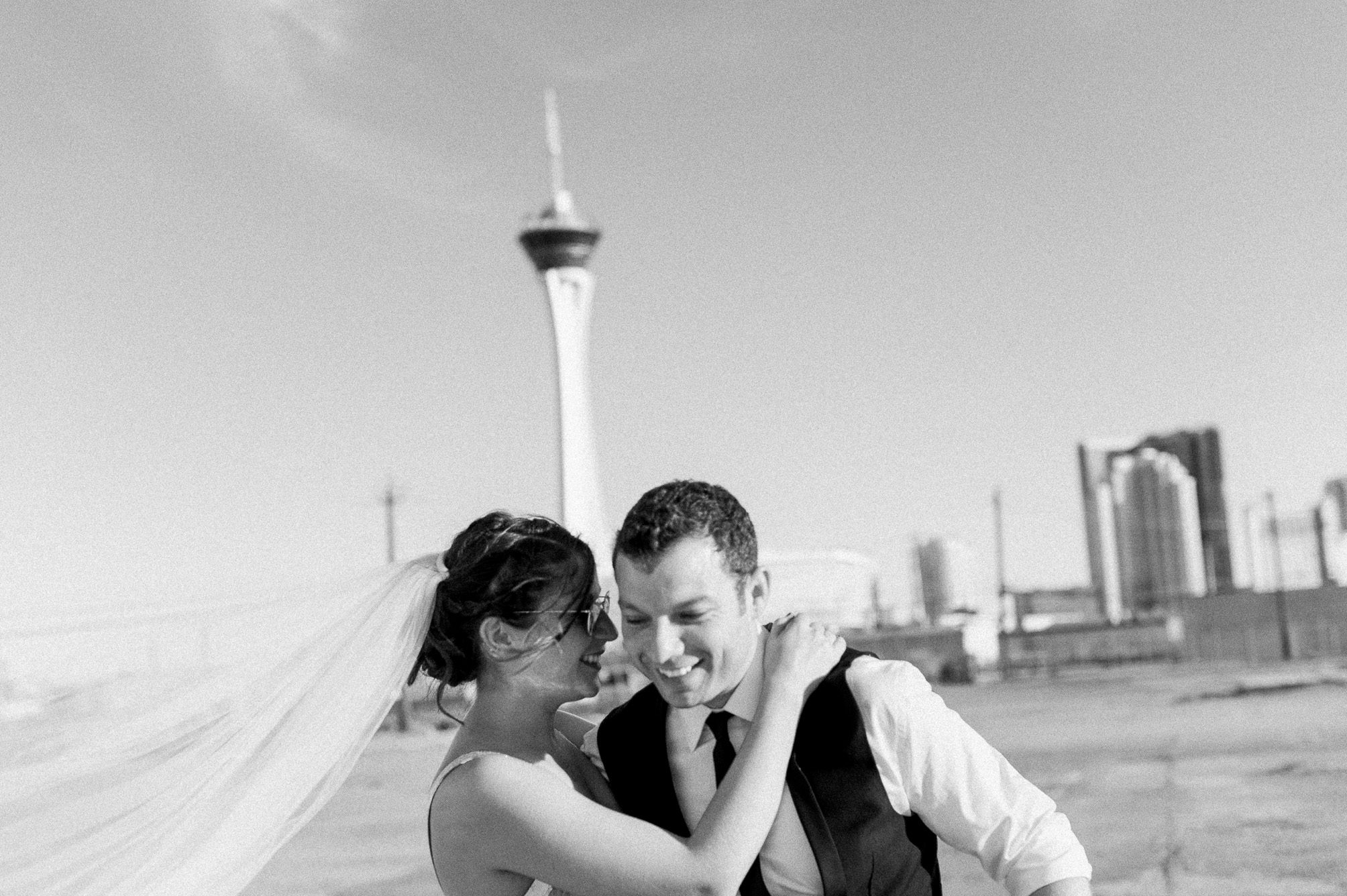 A blurry but beautiful black and white portrait of a newly married couple in Las Vegas. Captured by Las Vegas Elopement Photographer Briana Morrison