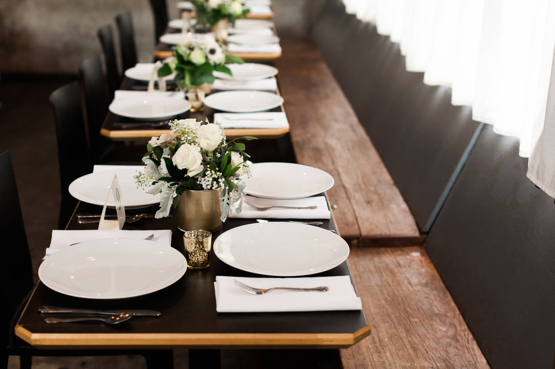 Beautifully set dining tables at Holocene in Portland, Oregon. By Portland Holocene Wedding Photographer Briana Morrison