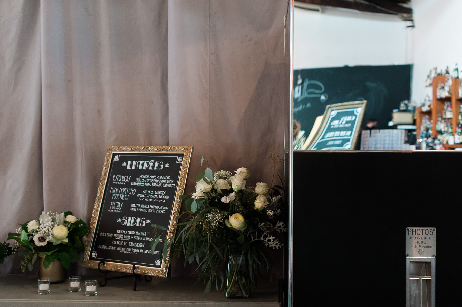 A chalkboard dinner menu and retro Photo Booth. By Portland Holocene wedding photographer Briana Morrison