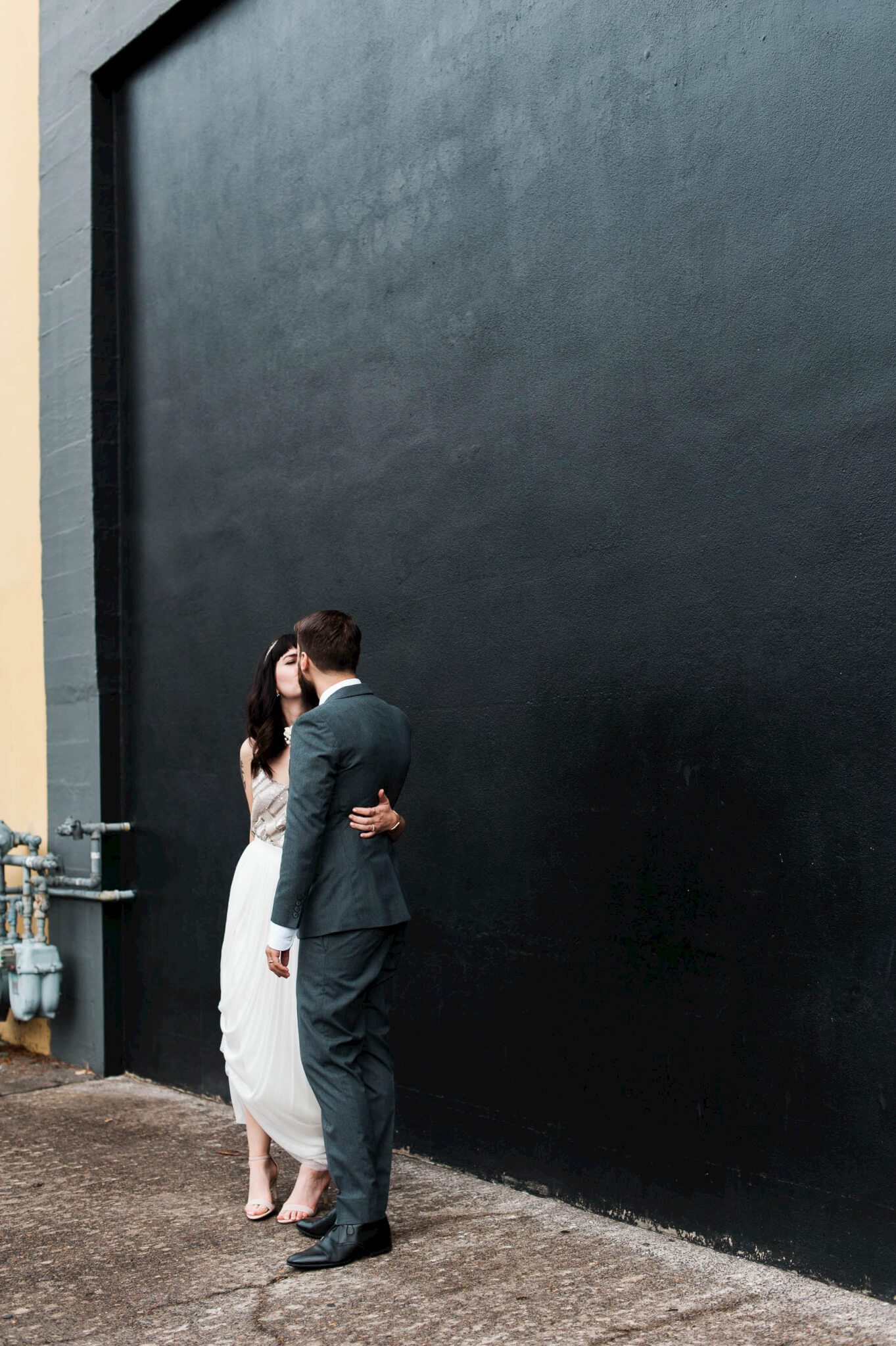 Husband and wife sneak kisses right after the ceremony. By Portland Holocene Wedding Photographer Briana Morrison