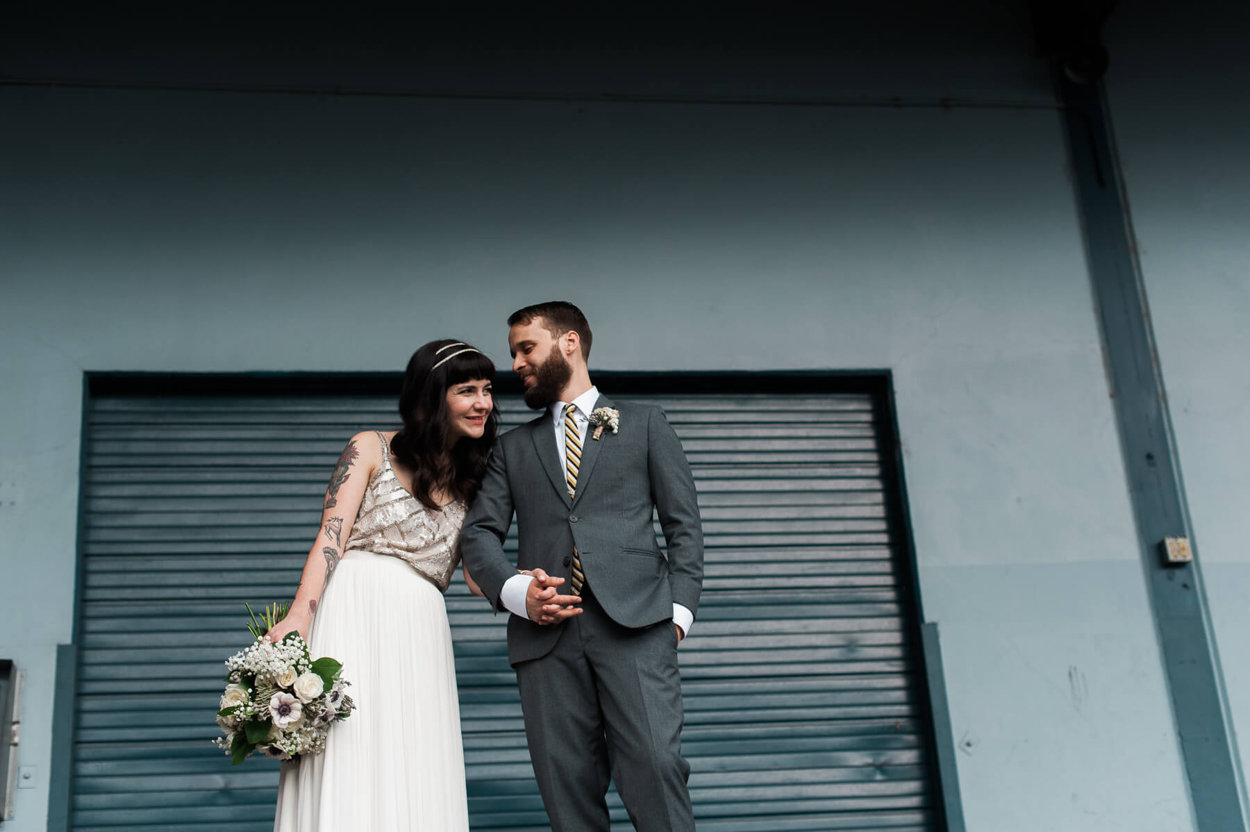 A hip bride and groom get married at Holocene in Portland, Oregon. Photography by Portland wedding photographer Briana Morrison