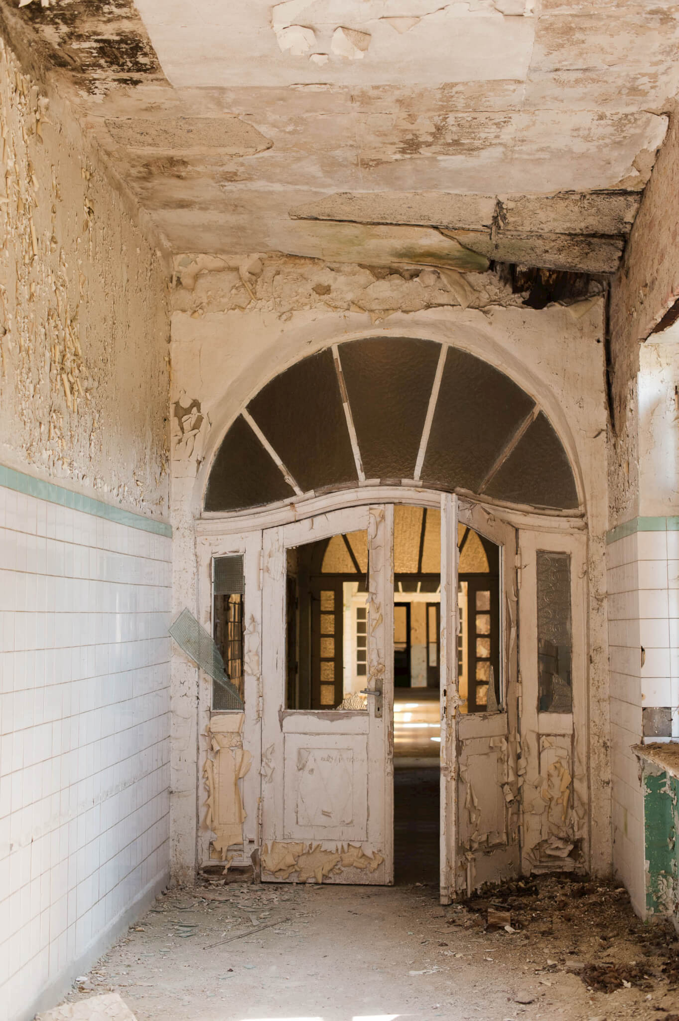 Decaying entrance to one of the Heilstätten Hohenlychen Sanatorium buildings in Lychen, Germany. Photographs by Berlin Portrait Photographer Briana Morrison