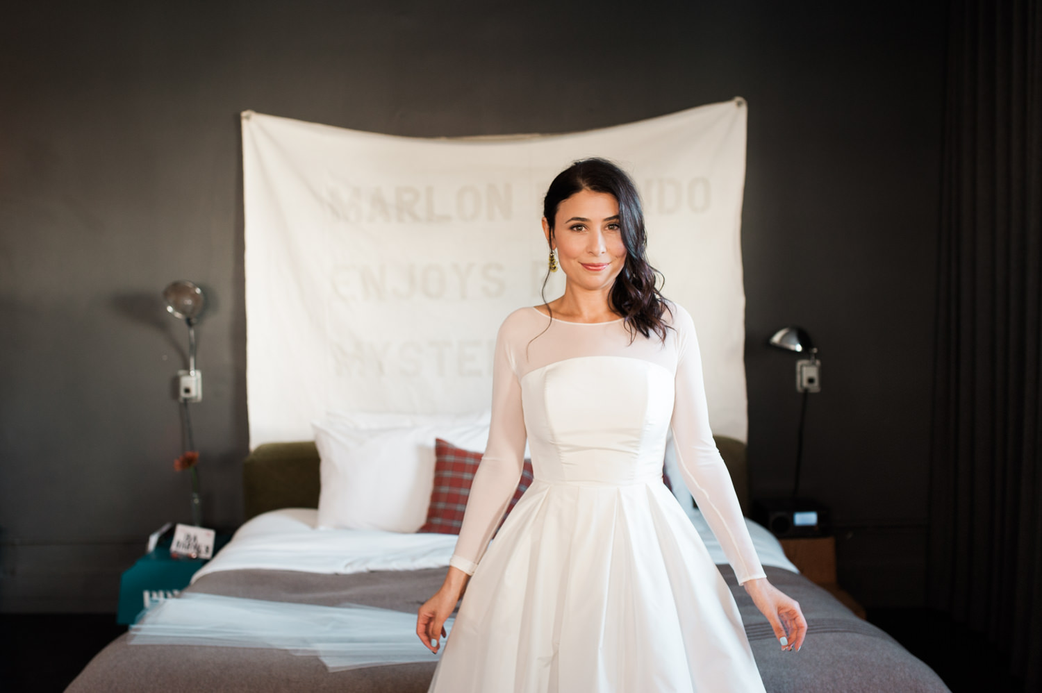 The beautiful bride in her mod wedding dress. by Ace Hotel wedding photographer Briana Morrison