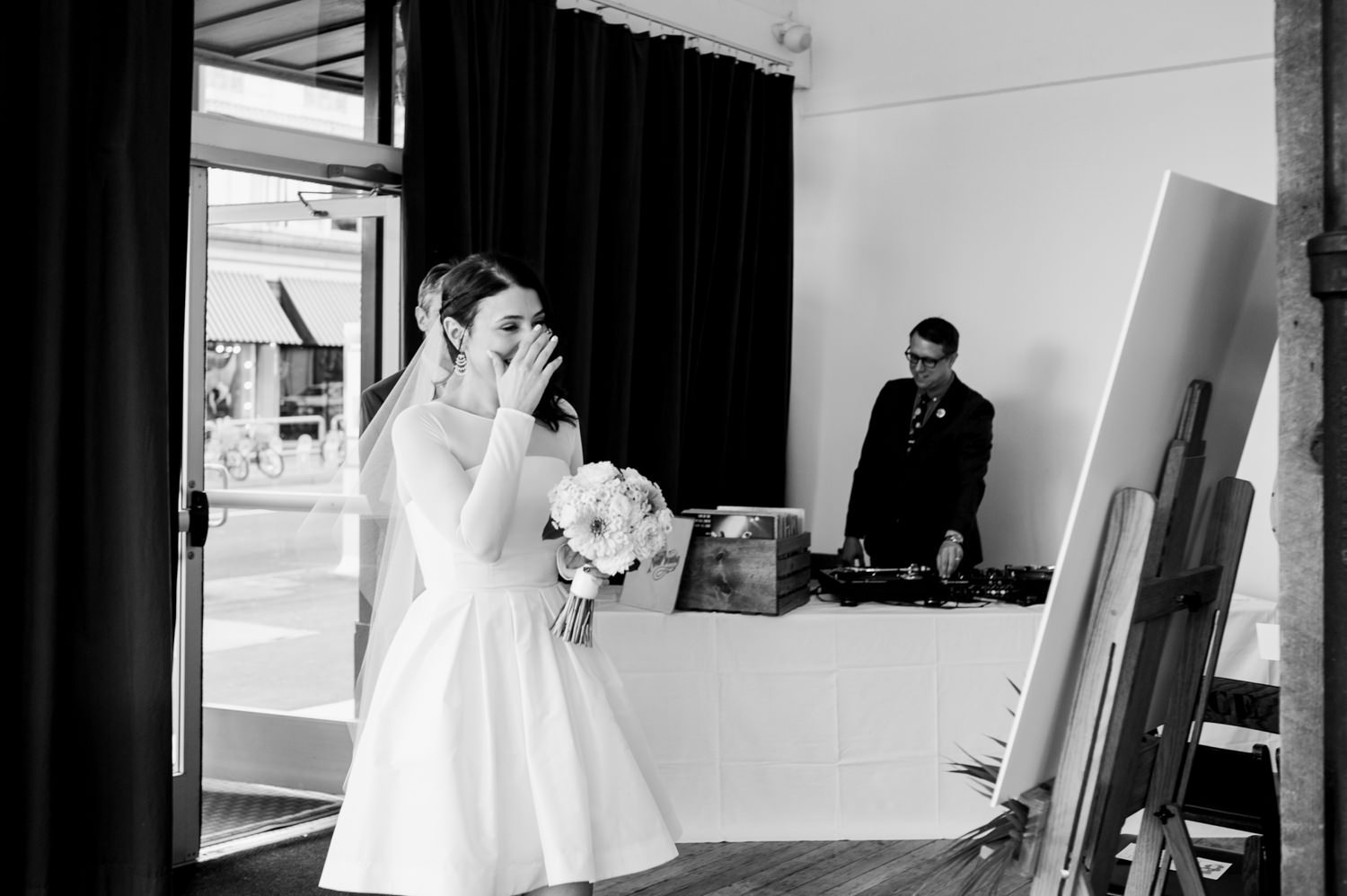 The bride gets emotional as she walks towards the aisle. by Ace Hotel wedding photographer Briana Morrison