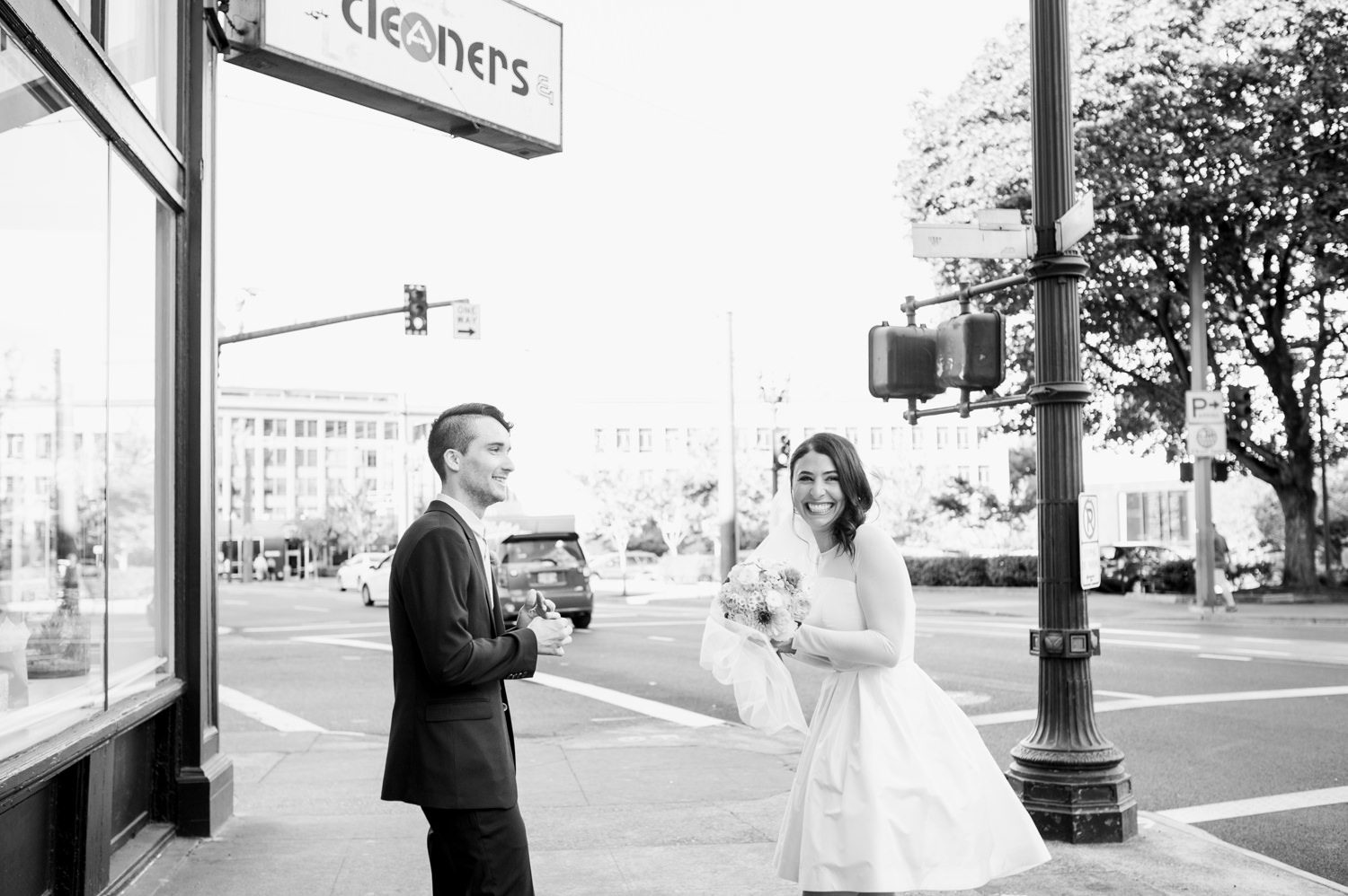 The newlyweds in black at white at The Cleaners. by Ace Hotel wedding photographer Briana Morrison
