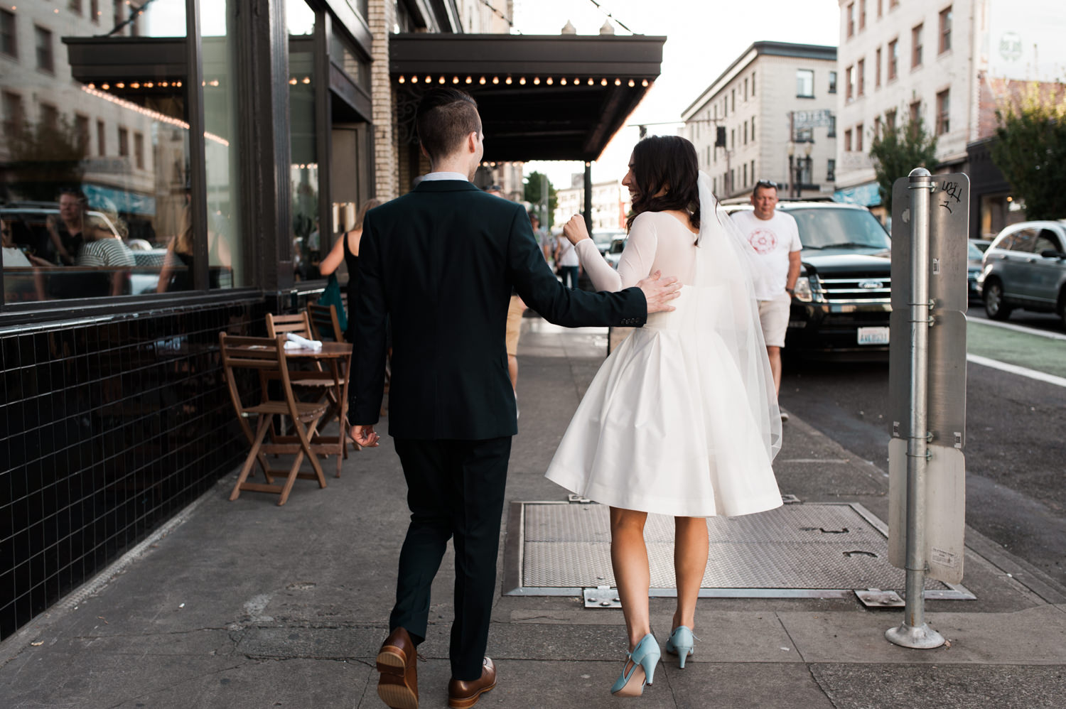 The bride and groom outside of Ace Hotel Portland. by Ace Hotel wedding photographer Briana Morrison