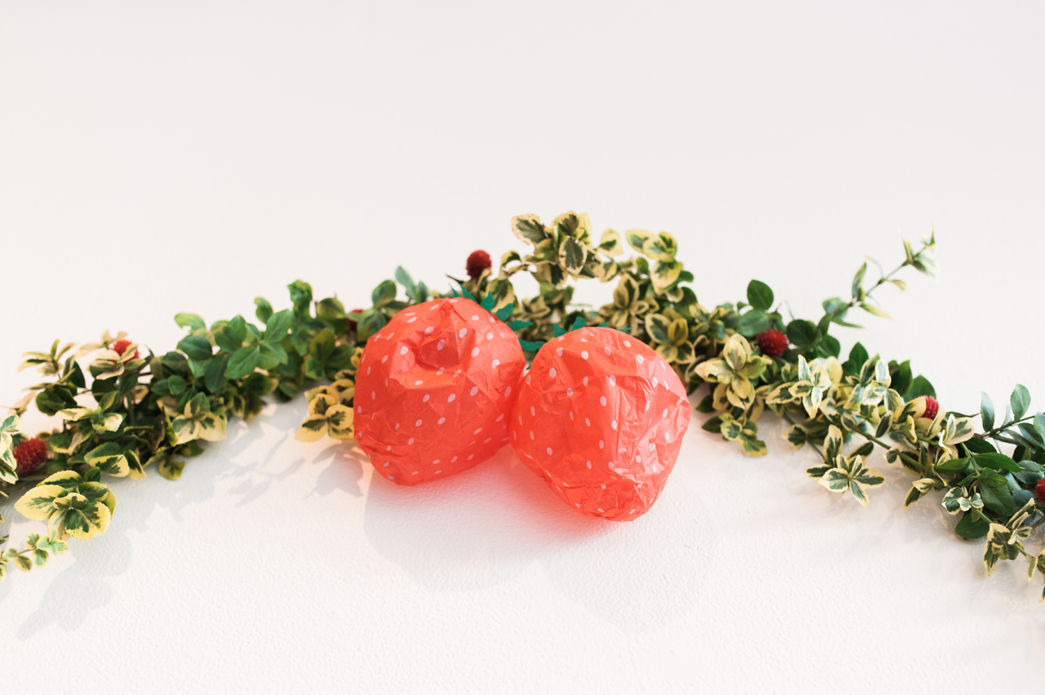 Paper strawberry wedding decorations by Ace Hotel wedding photographer Briana Morrison