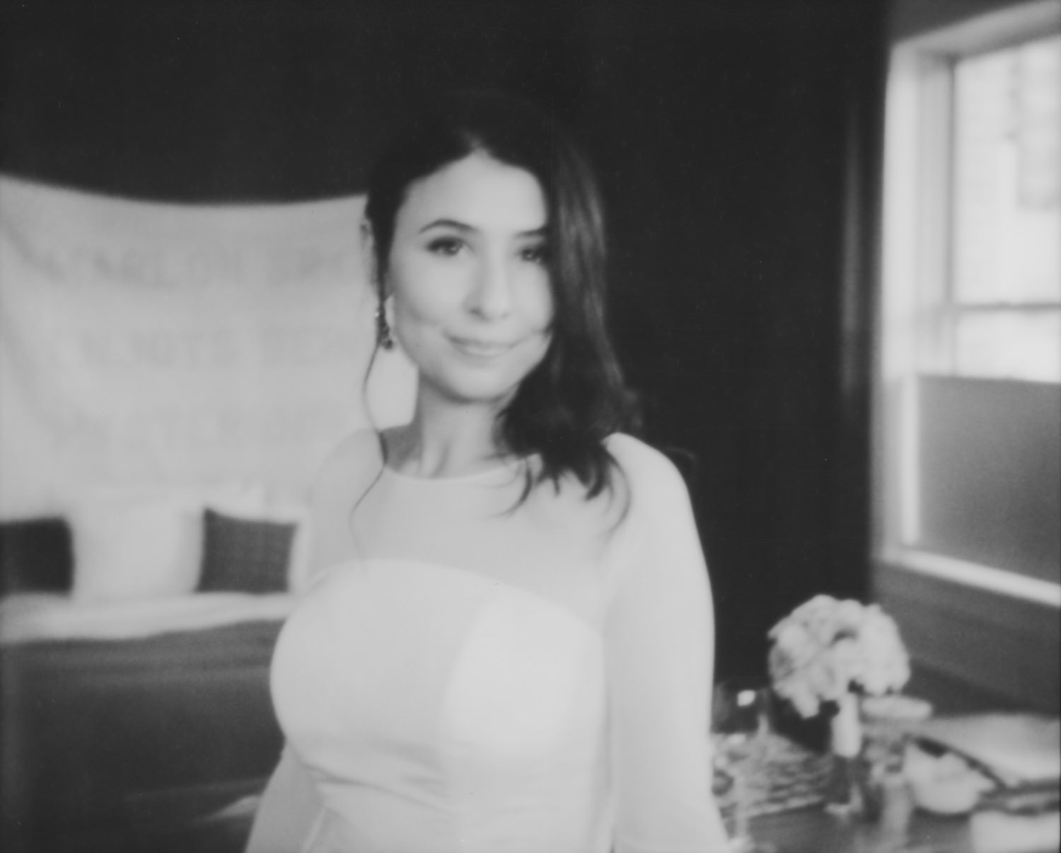 Blurry black and white Polaroid of the bride. by Ace Hotel wedding photographer Briana Morrison