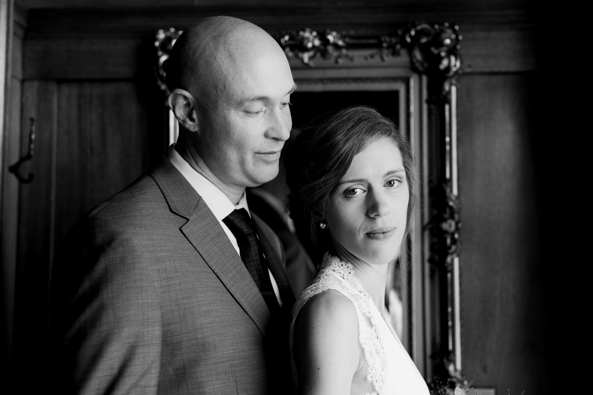 A black and white portrait of the bride and groom in the Portland Mayor's Mansion. By Laurelhurst Park wedding photographer Briana Morrison