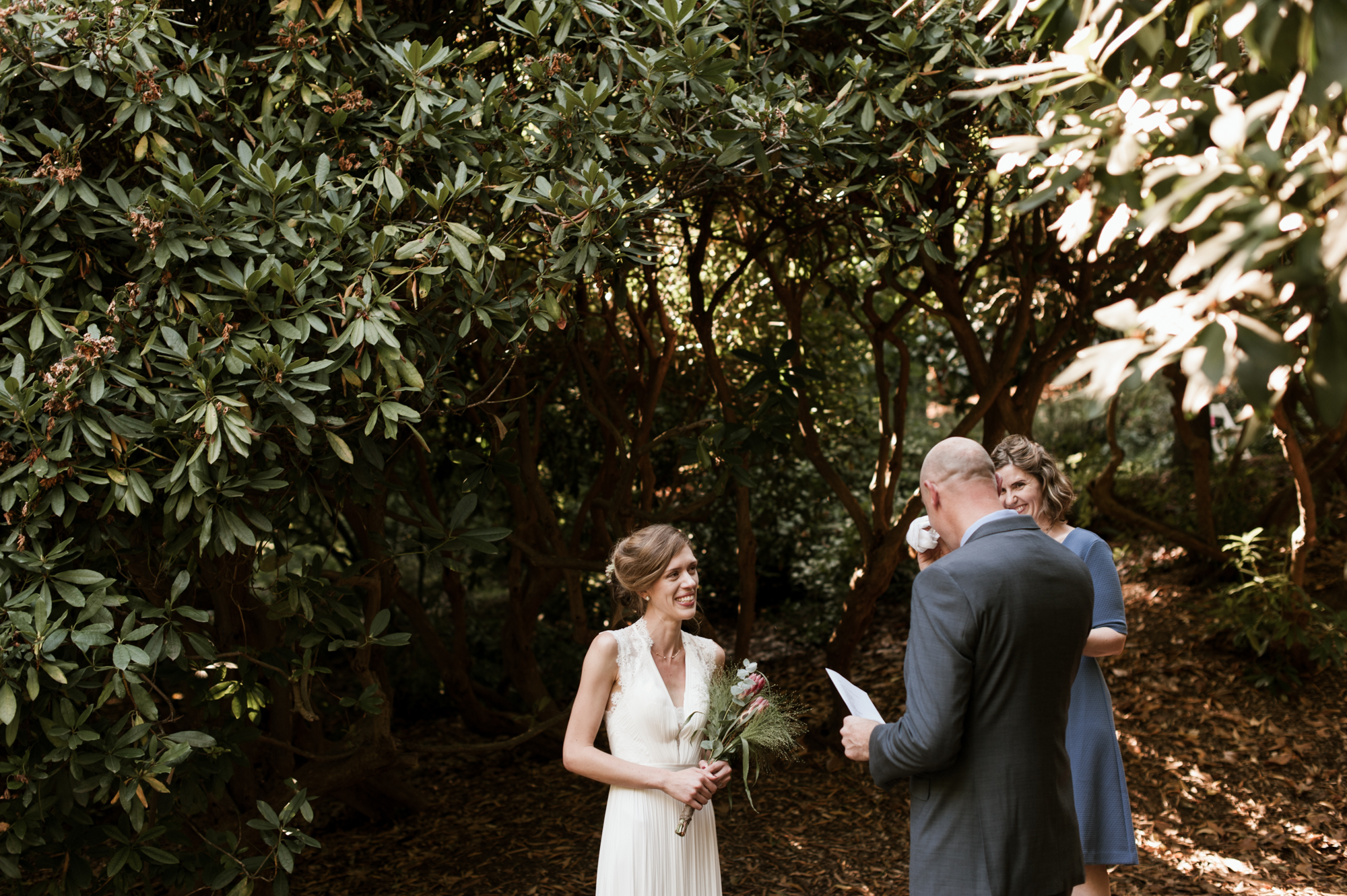 The groom cries as he says his vows. By Laurelhurst Park wedding photographer Briana Morrison