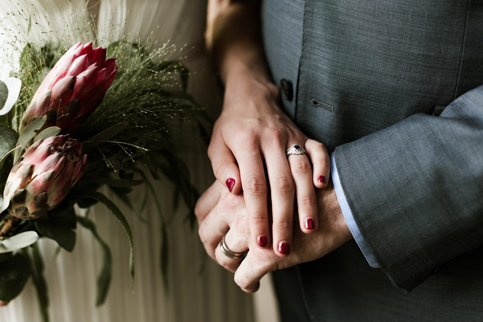 Wedding rings and a beautiful bouquet. By Laurelhurst Park wedding photographer Briana Morrison