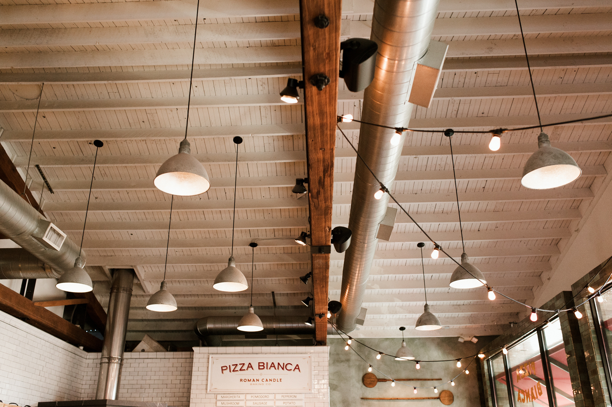 Ceiling details at Roman Candle Baking Co. By wedding photographer Briana Morrison