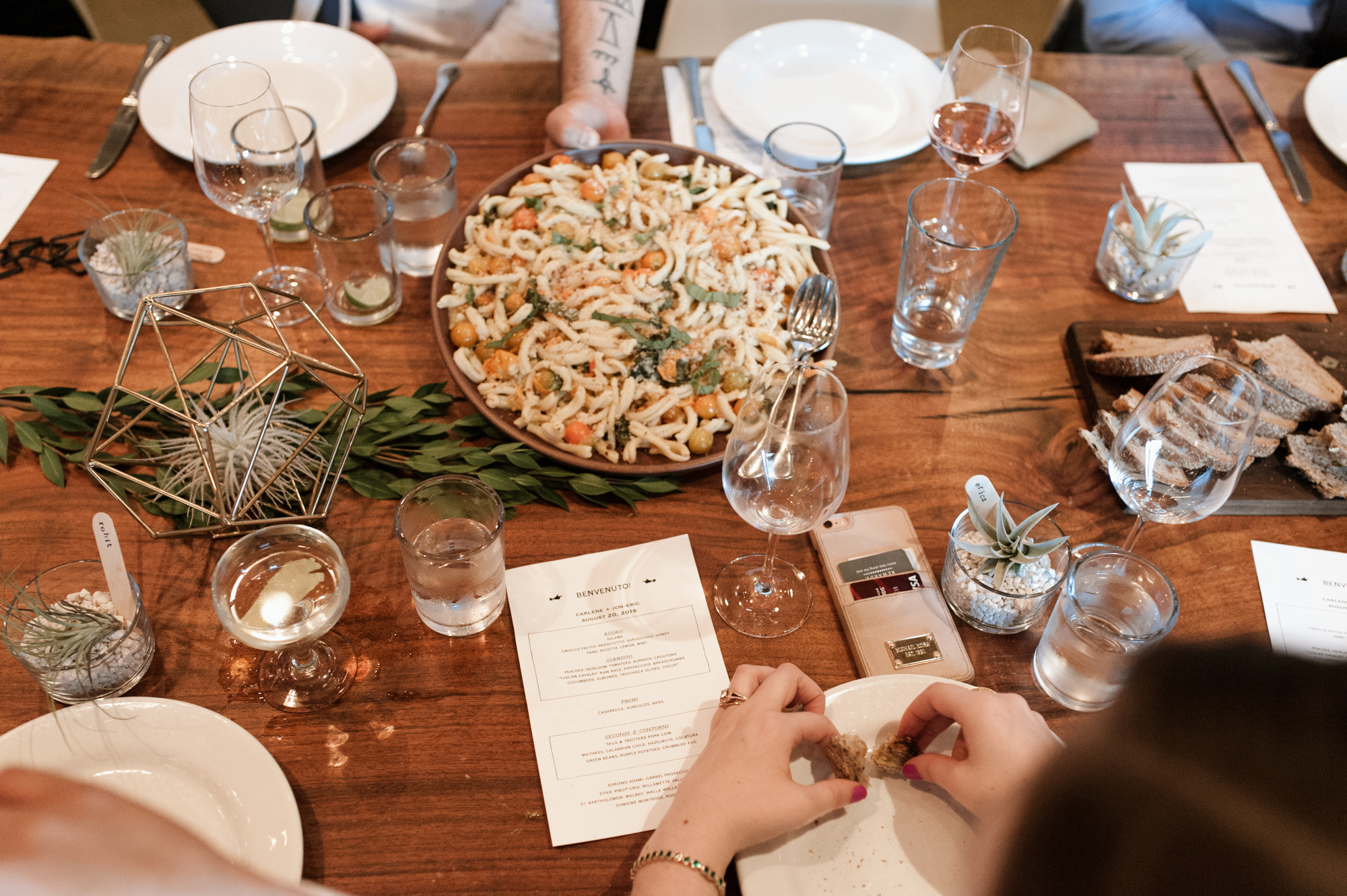 Wedding reception dinner is served at Roman Candle Baking Co. by wedding photographer Briana Morrison