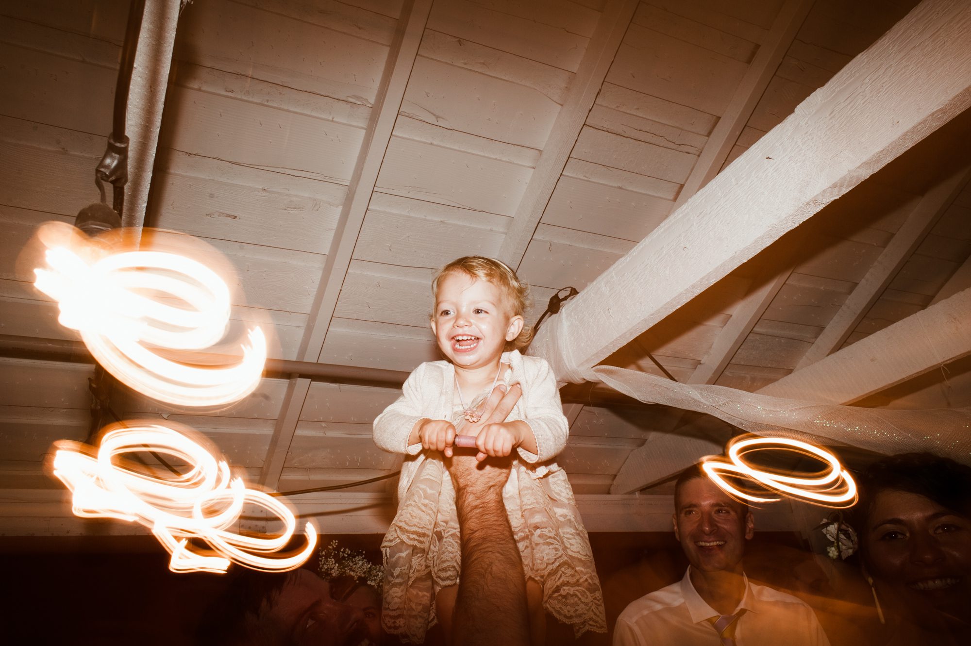 Baby dances at a wedding. By Sou'Wester wedding photographer Briana Morrison