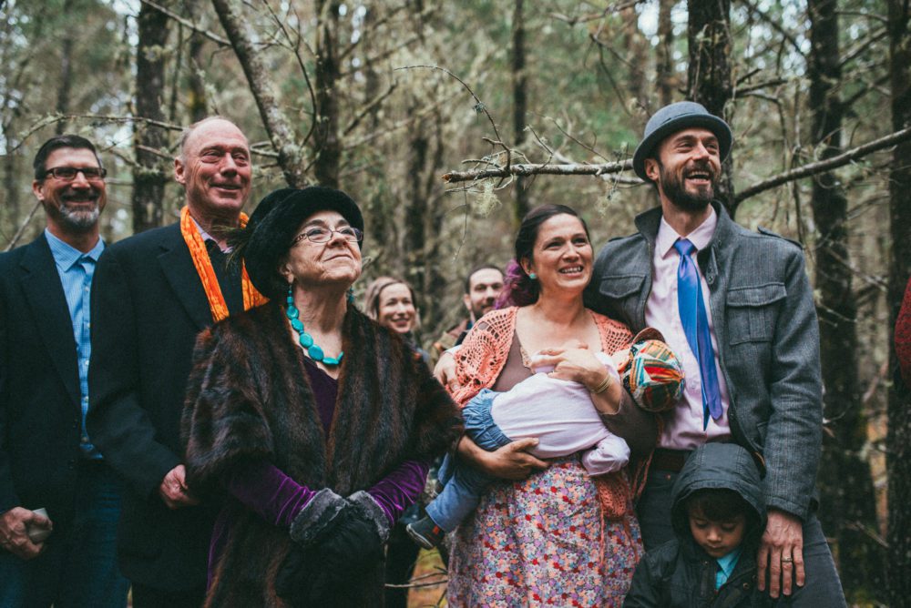 Family observing a wedding ceremony on the Washington coast.