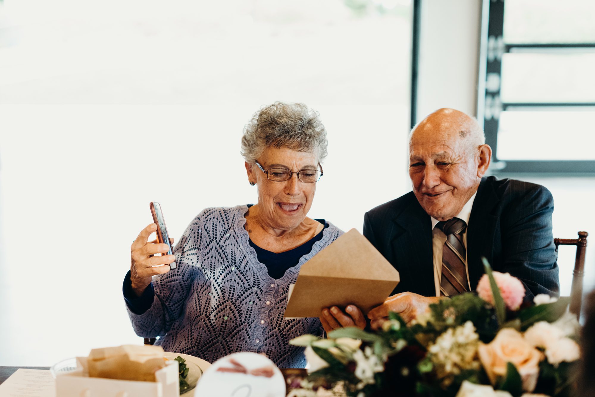 Wedding guests admire their Bad Portraits by Karlee