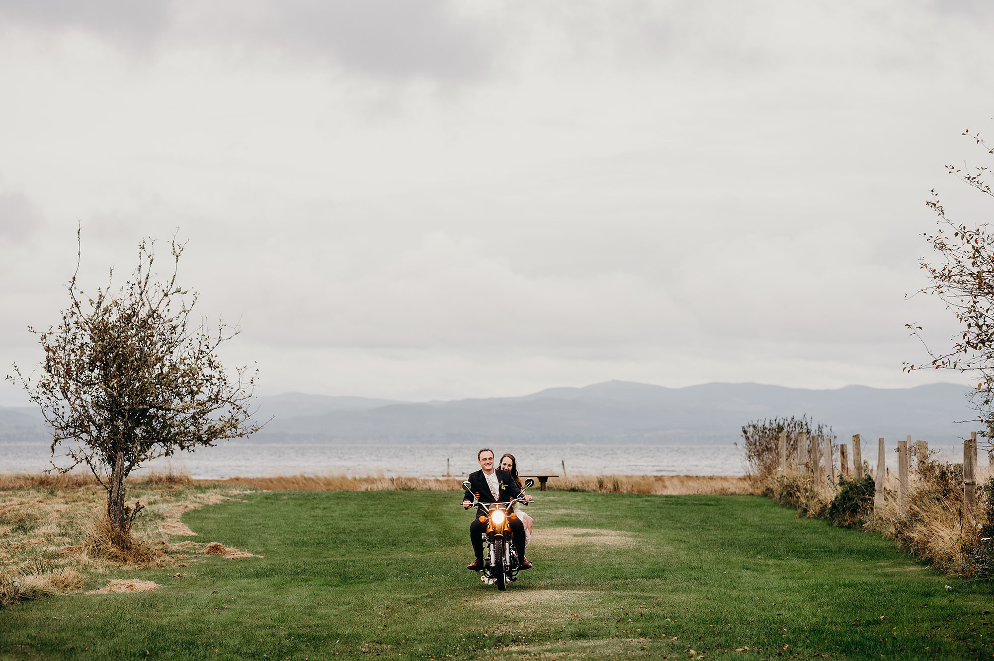 Long Beach Peninsula Wedding Bride & Groom Riding Back on Motorcycle by Briana Morrison Photography