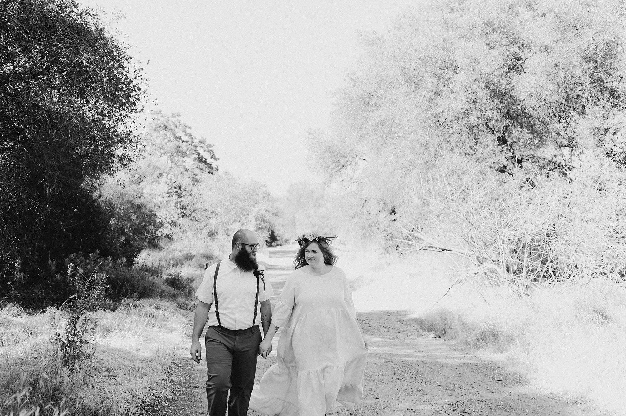 Bride & Groom Walking Down a Road Together