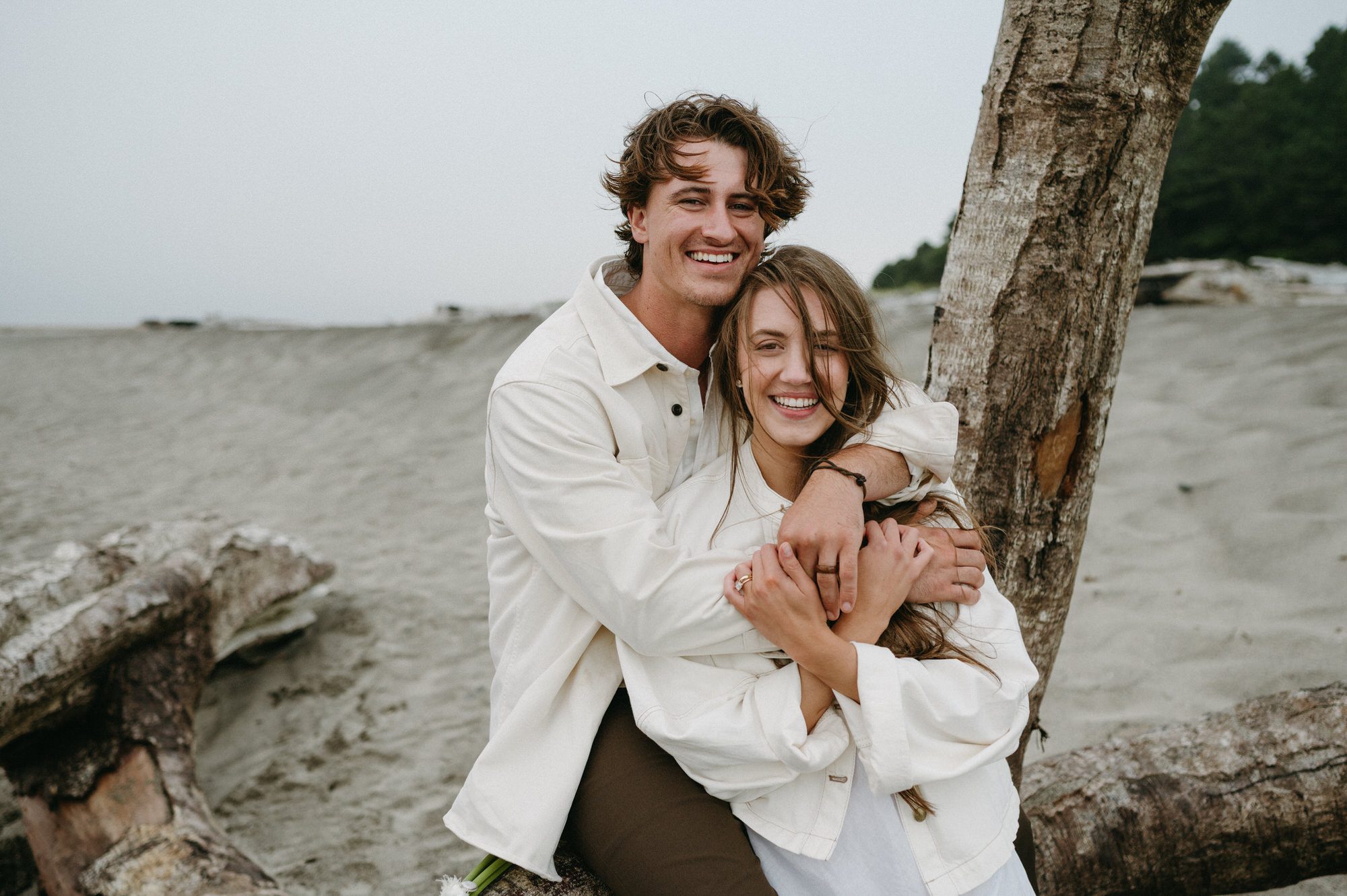 Salmonberry Inn Wedding beach portrait of newlyweds smiling at the camera.