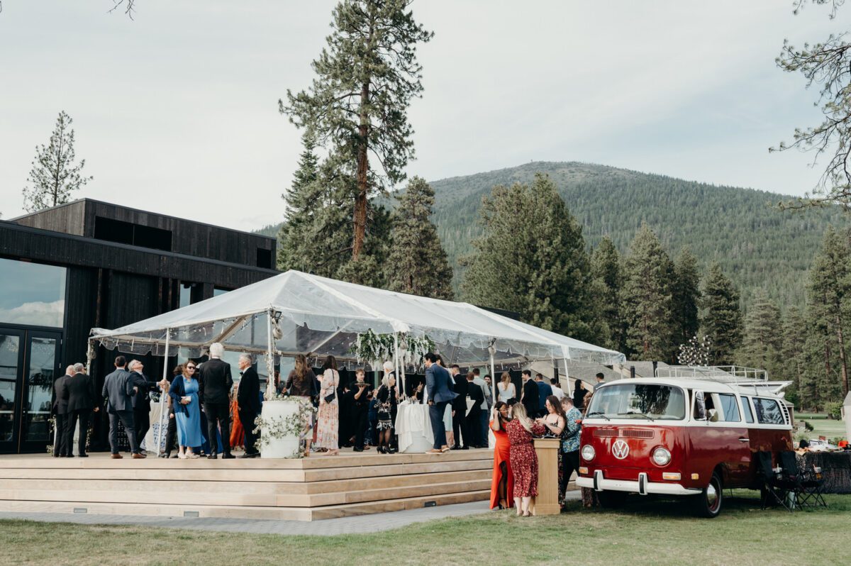Wedding guests mingle on the deck just outside of the Black Butte Ranch lodge.