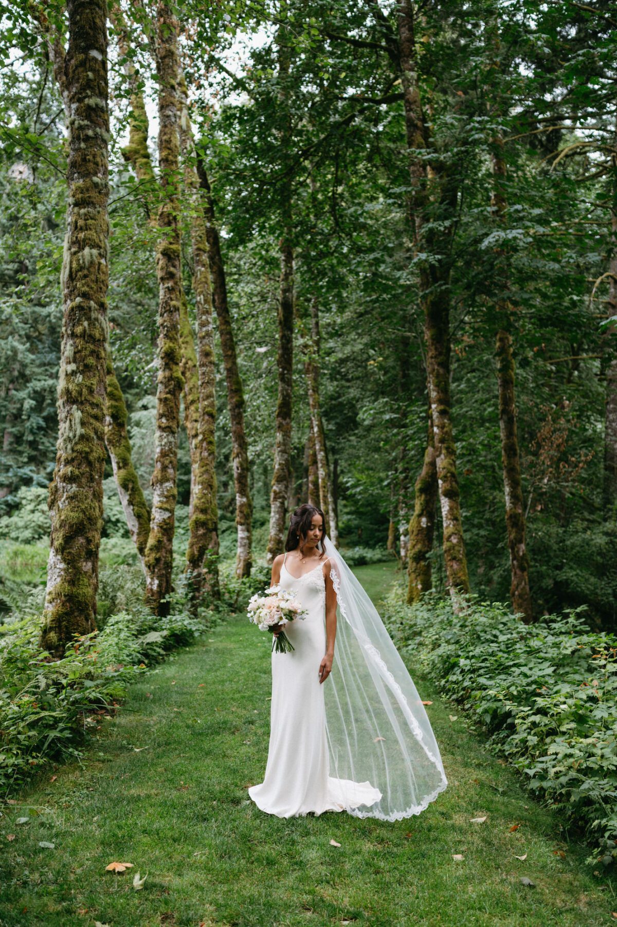 A beautiful wooded path around the lake at Bridal Veil Lakes