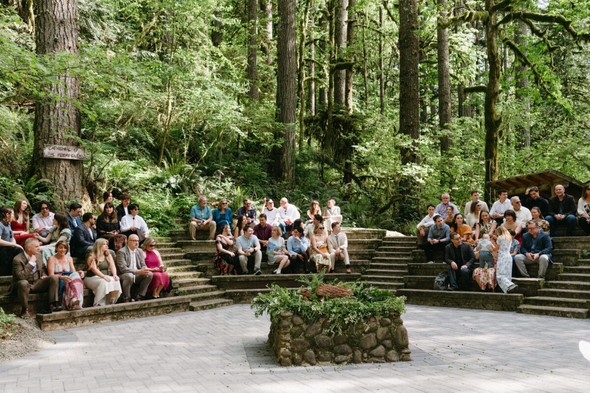 Guests fill the amphitheater style seating at the Camp Namanu ceremony site. Photography by Briana Morrison